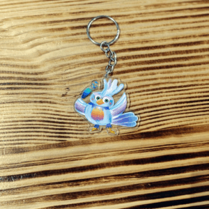 Porte-clé - Nova, l’oiseau voyageur et la plume magique