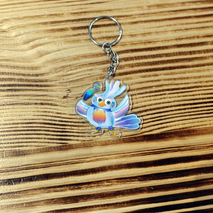 Porte-clé - Nova, l’oiseau voyageur et la plume magique